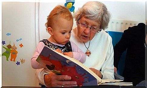 Grandmother reads fairy tale to granddaughter
