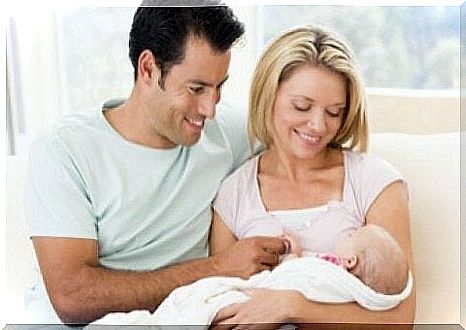 New parents with their child