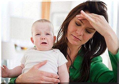 Mom with headache and crying son.