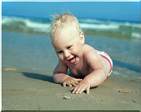 Newborn baby on the beach