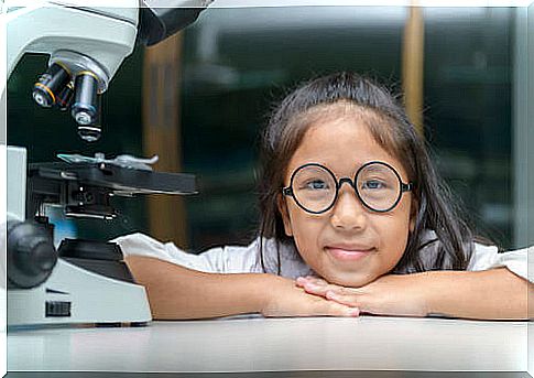 Little girl who just used a microscope.