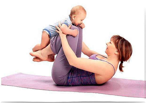 Woman doing exercises with her baby