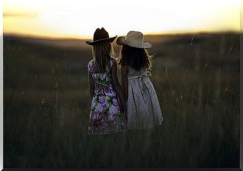 Sisters from behind in nature