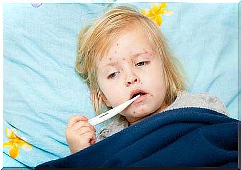 Little girl in bed with small red spots