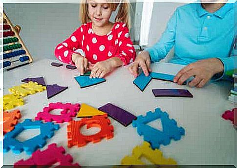 Little girl learning math by playing.