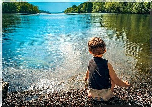 Child plays with water