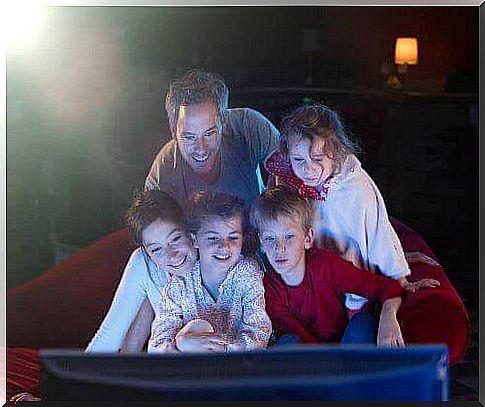 Family in front of the television