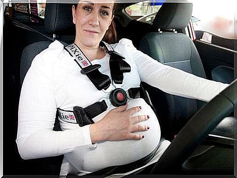 Pregnant woman driving.