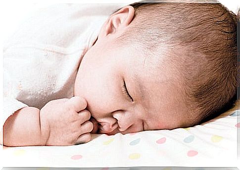 What should I do if my child lies face down while sleeping?