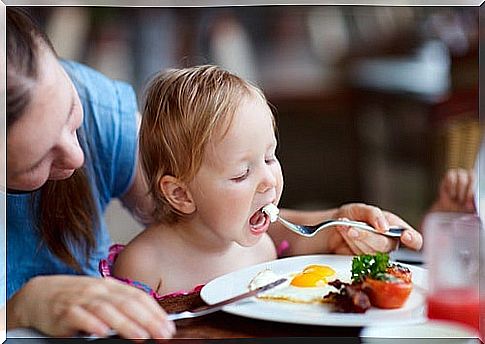 mom-feeding-her-son